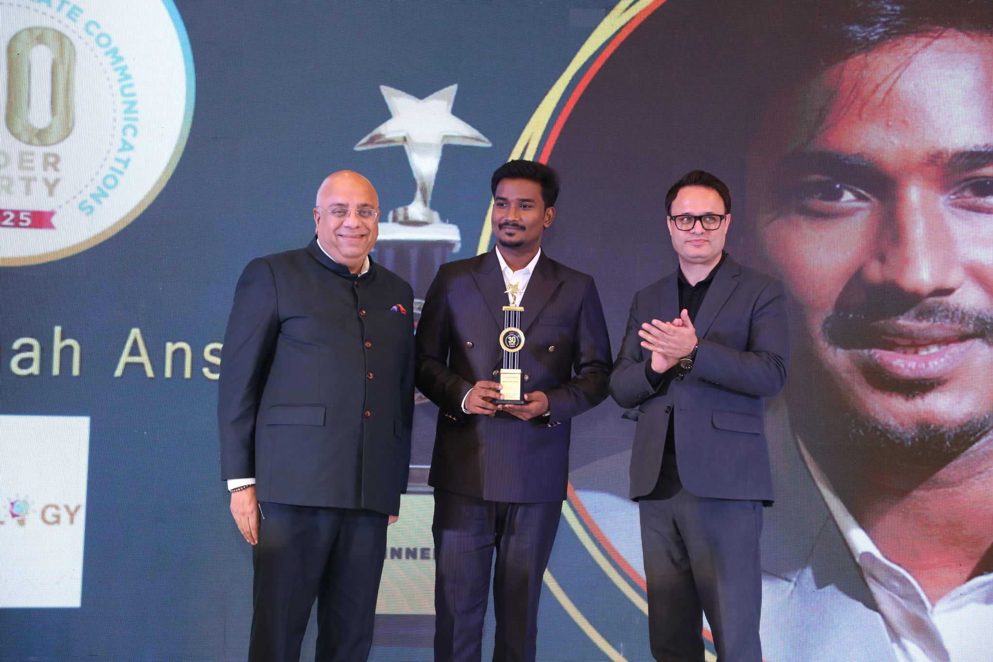 Md Badshah Ansari receiving e4m 30 Under 30 Award